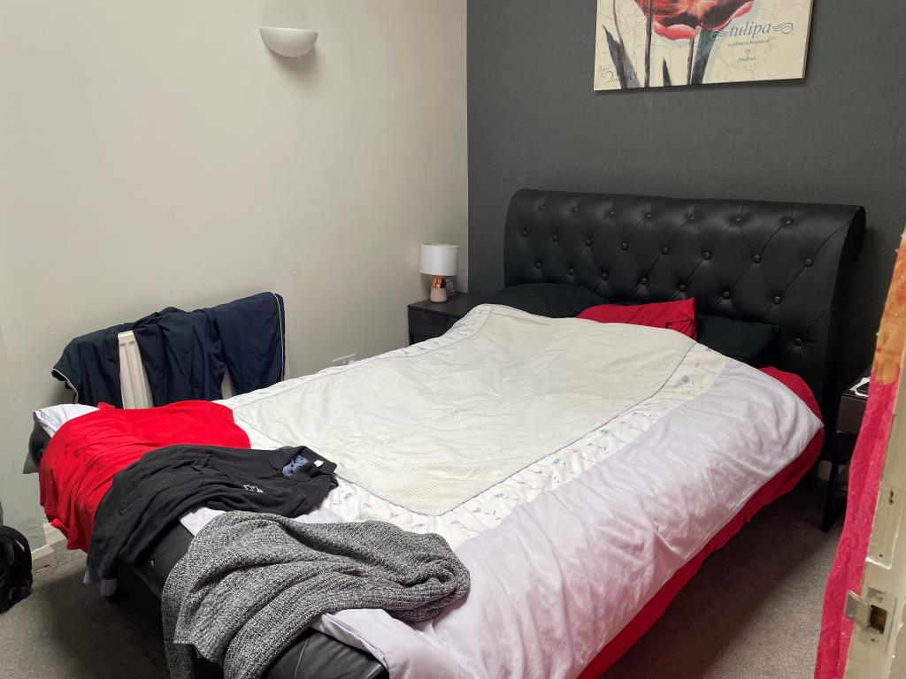 Lot: 79 - FREEHOLD SHOP AND FLAT WITH UPPER PARTS - view of bedroom with double bed in rear flat